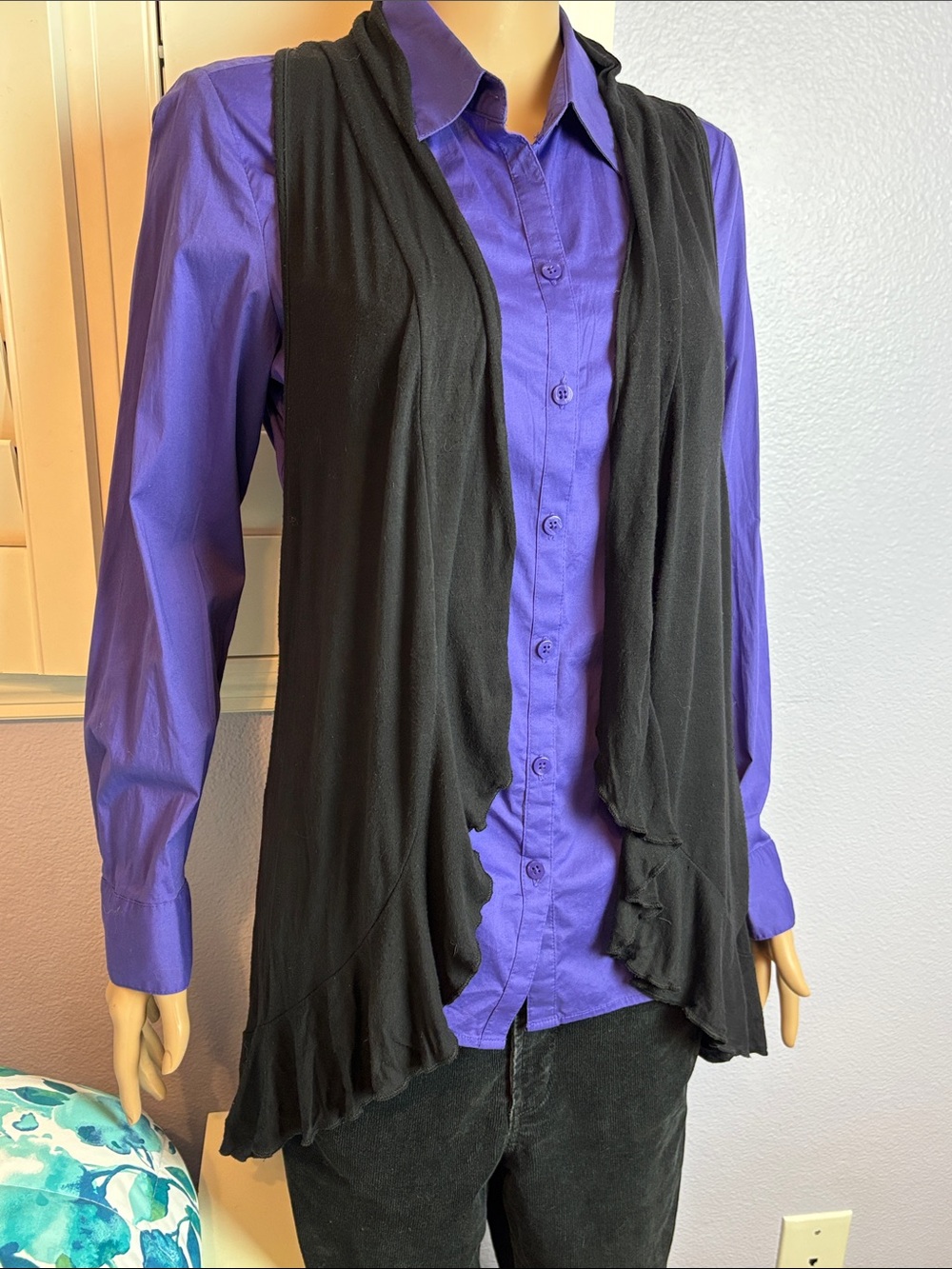 Black flowy circle vest with ruffled hem